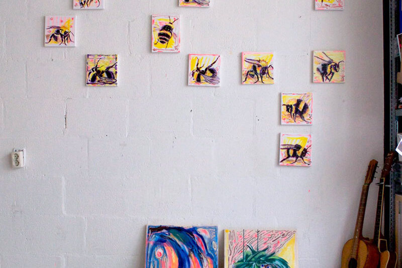 wall with 11 paintings of bumblebee and bees