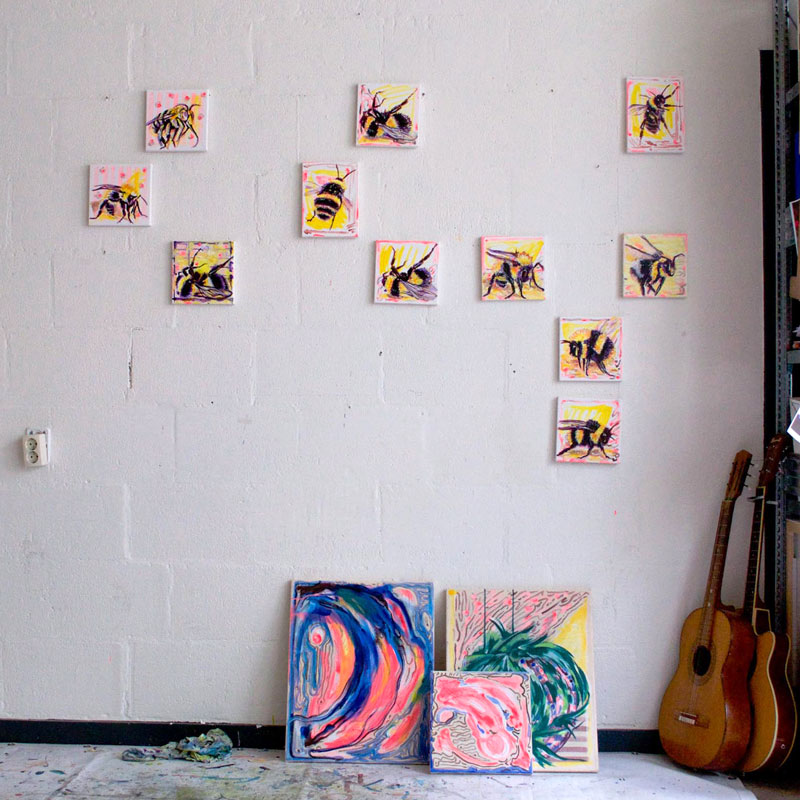 wall with 11 paintings of bumblebee and bees